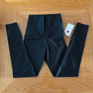 New with tags Emily Hsu Design high waisted shiny leggings . Size M. Made in USA